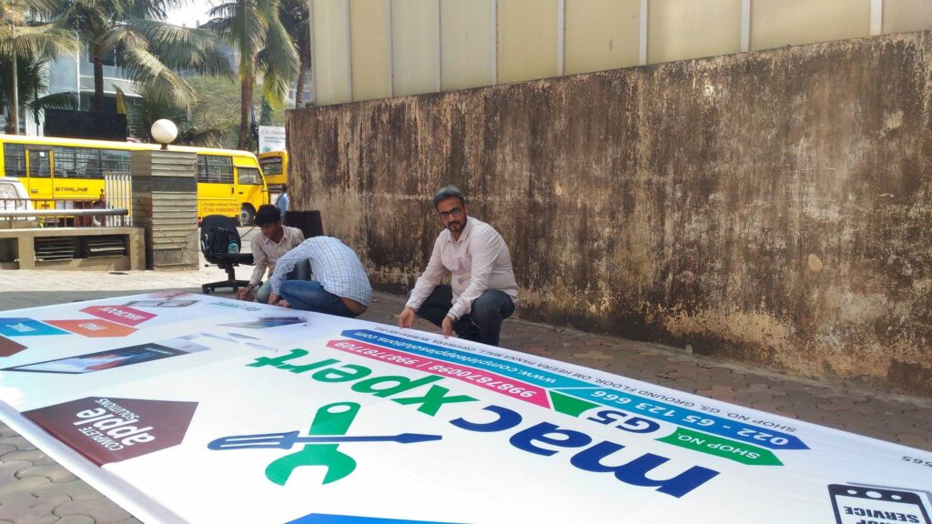 Flex Signboard Banner Designing, Printing and Installation for Mac Xpert Mumbai by Creativo Camaal